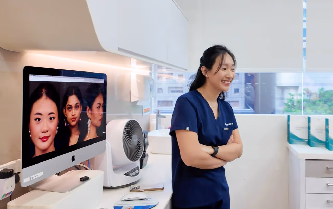 Dr. Pearlyn Ng smiling with contestants on screen