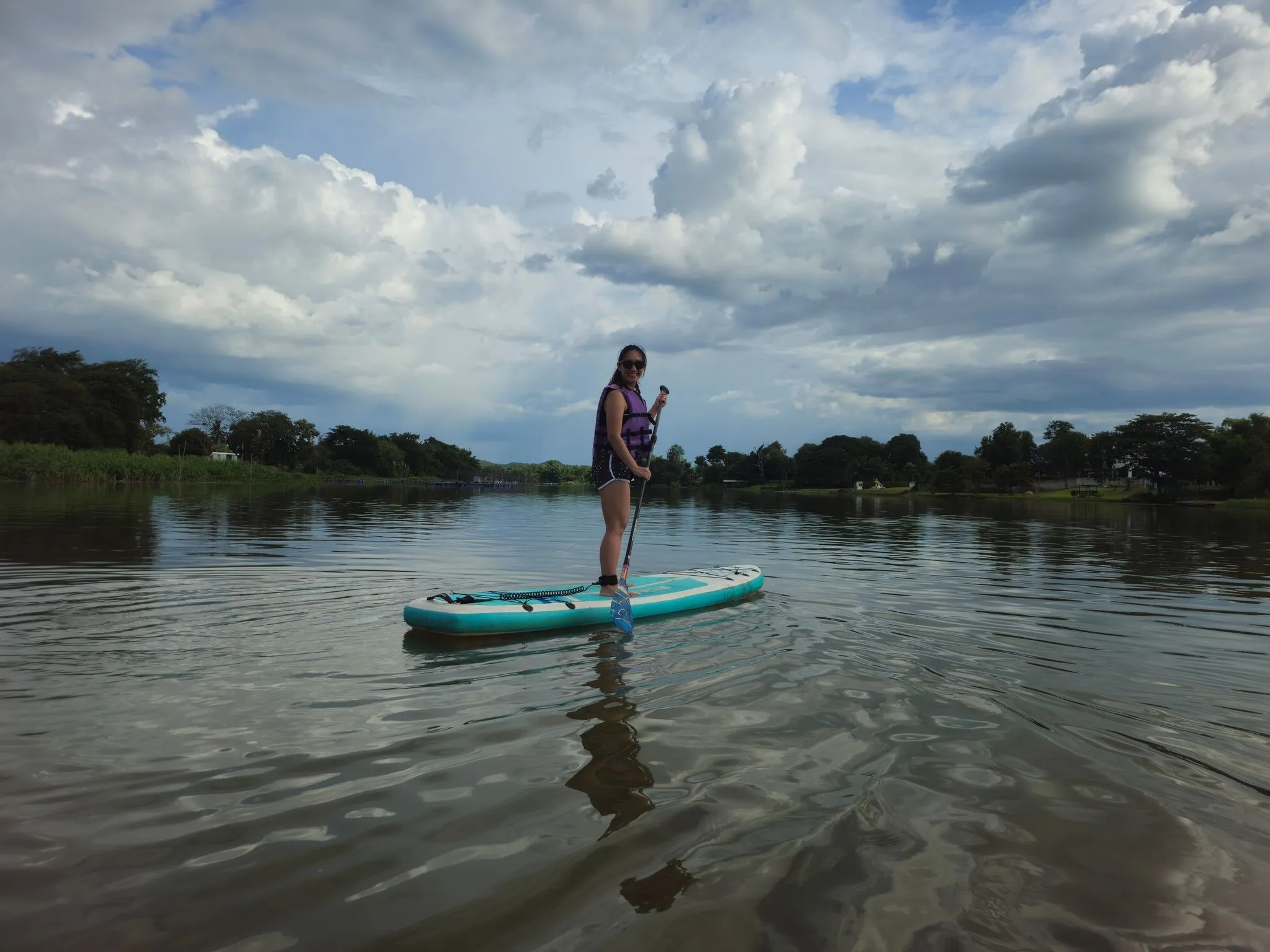 Dr. Pearlyn Ng on a paddle board