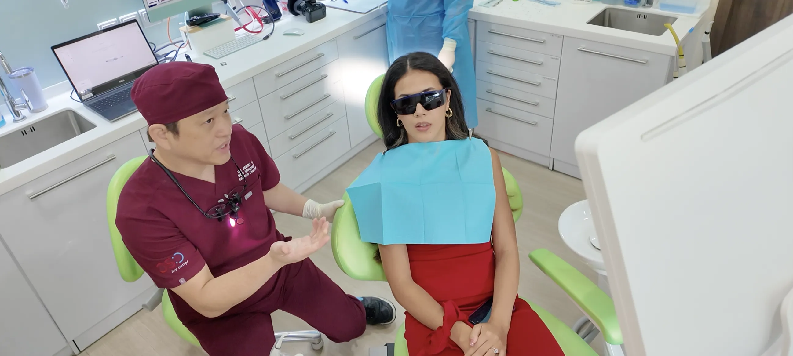 Dr. Jerry Lim explaining a treatment to patient